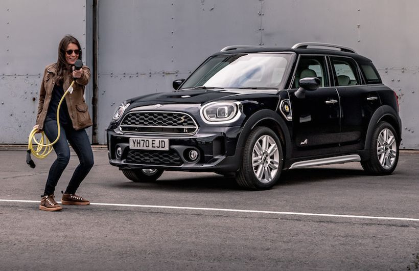 Ginny Buckley next to Mini PHEV with charging cable